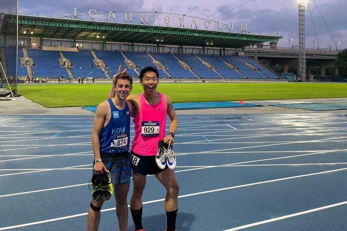 Lulab members at a stadium for a race.